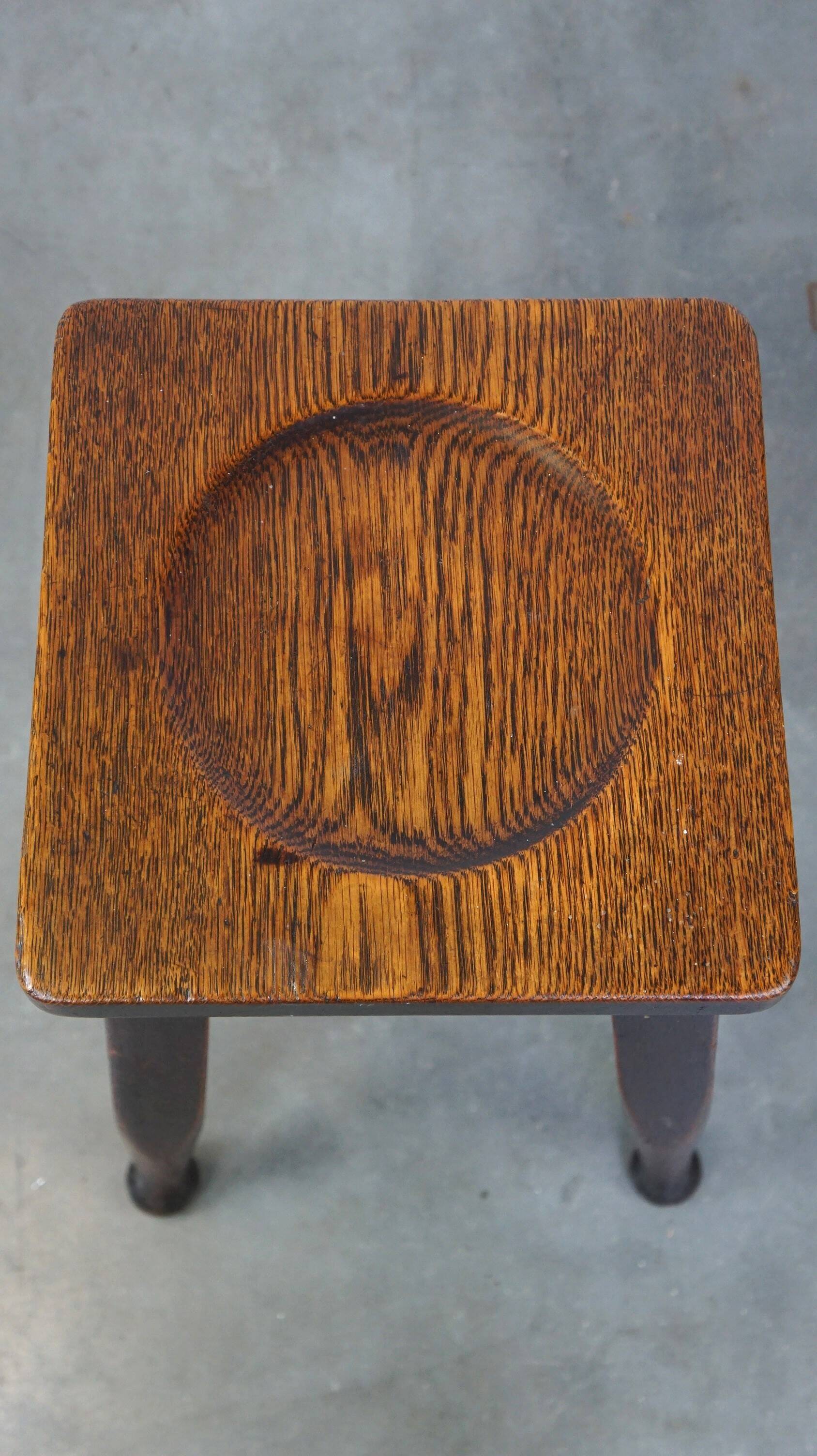 Antique English solid oak stool with a touch of art nouveau style