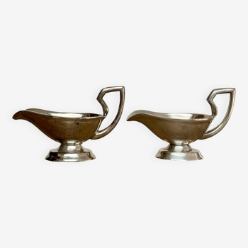 Duo of small silver metal sauce boats