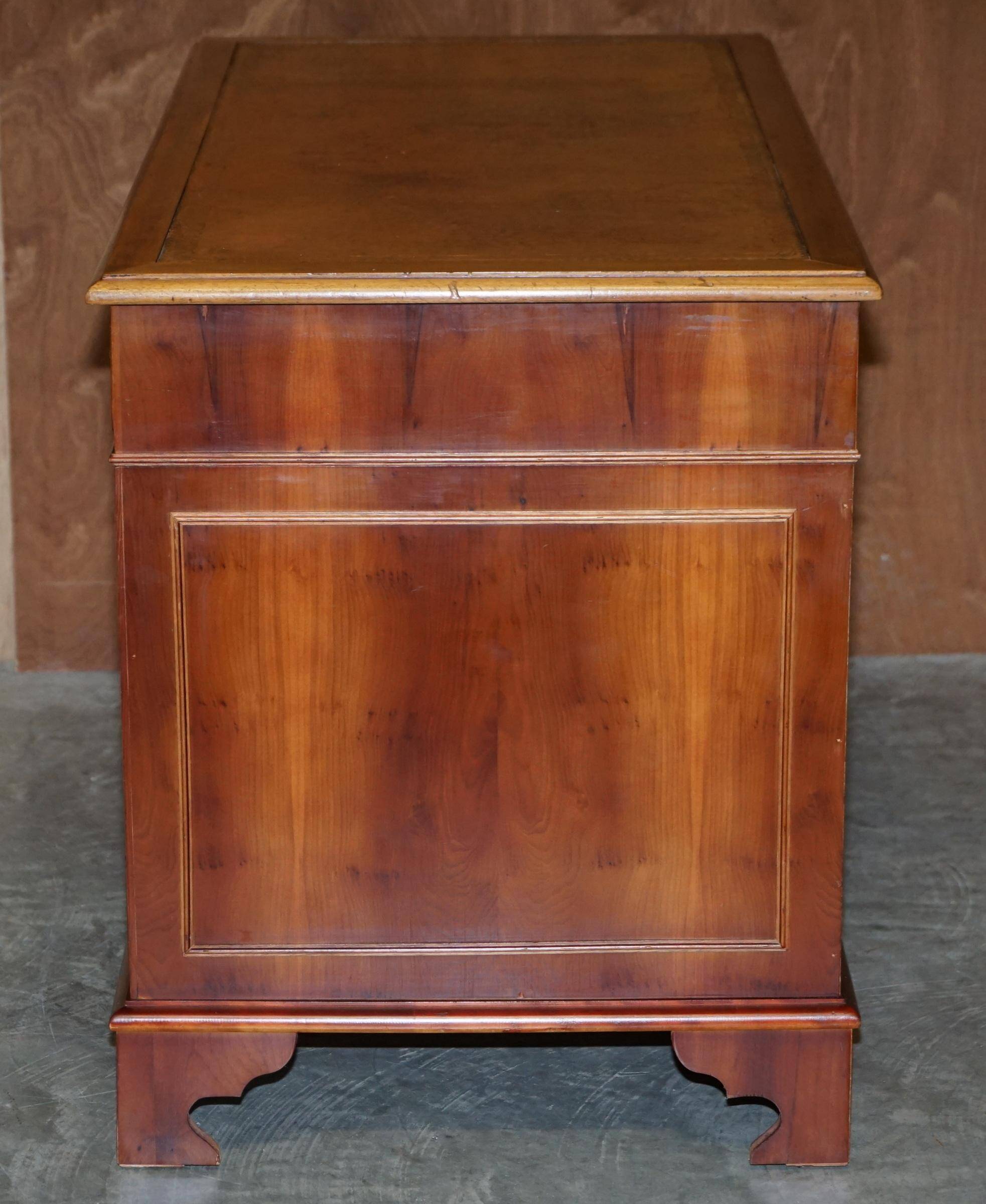 Vintage walnut desk with a leather top and two drawers.