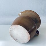 Old pitcher in glazed terracotta