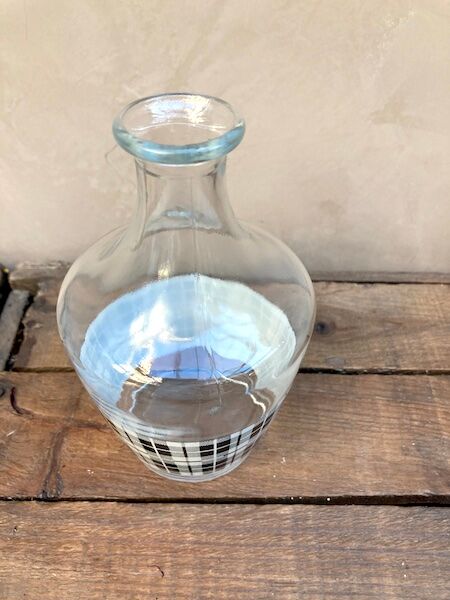 Vintage decanter with black and white tiles