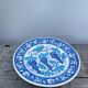 Blue decorative plate with grapes