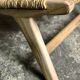 Low armchair in raw teak with seat and mulched backrest