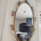 Oval mirror in gilded brass and floral horn, 1950s