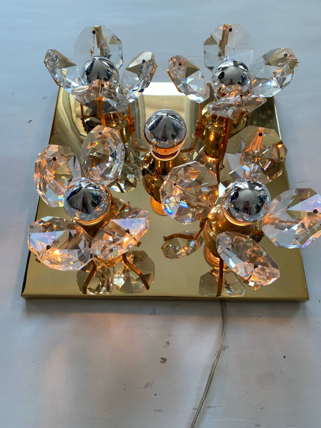 Brass wall lamp with glass prisms