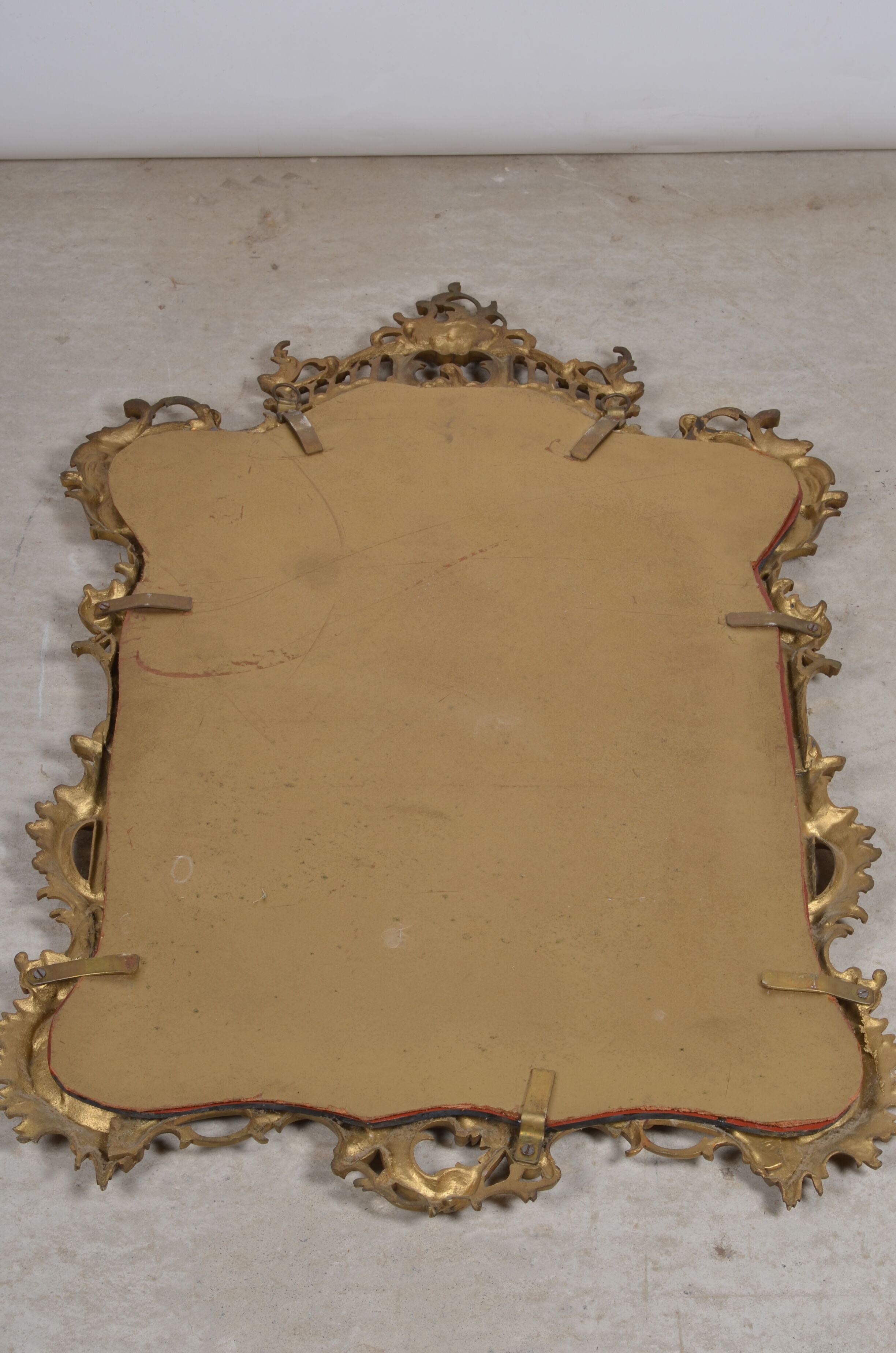 Mirror with baroque style parecloses in bronze 102 x 61 cm