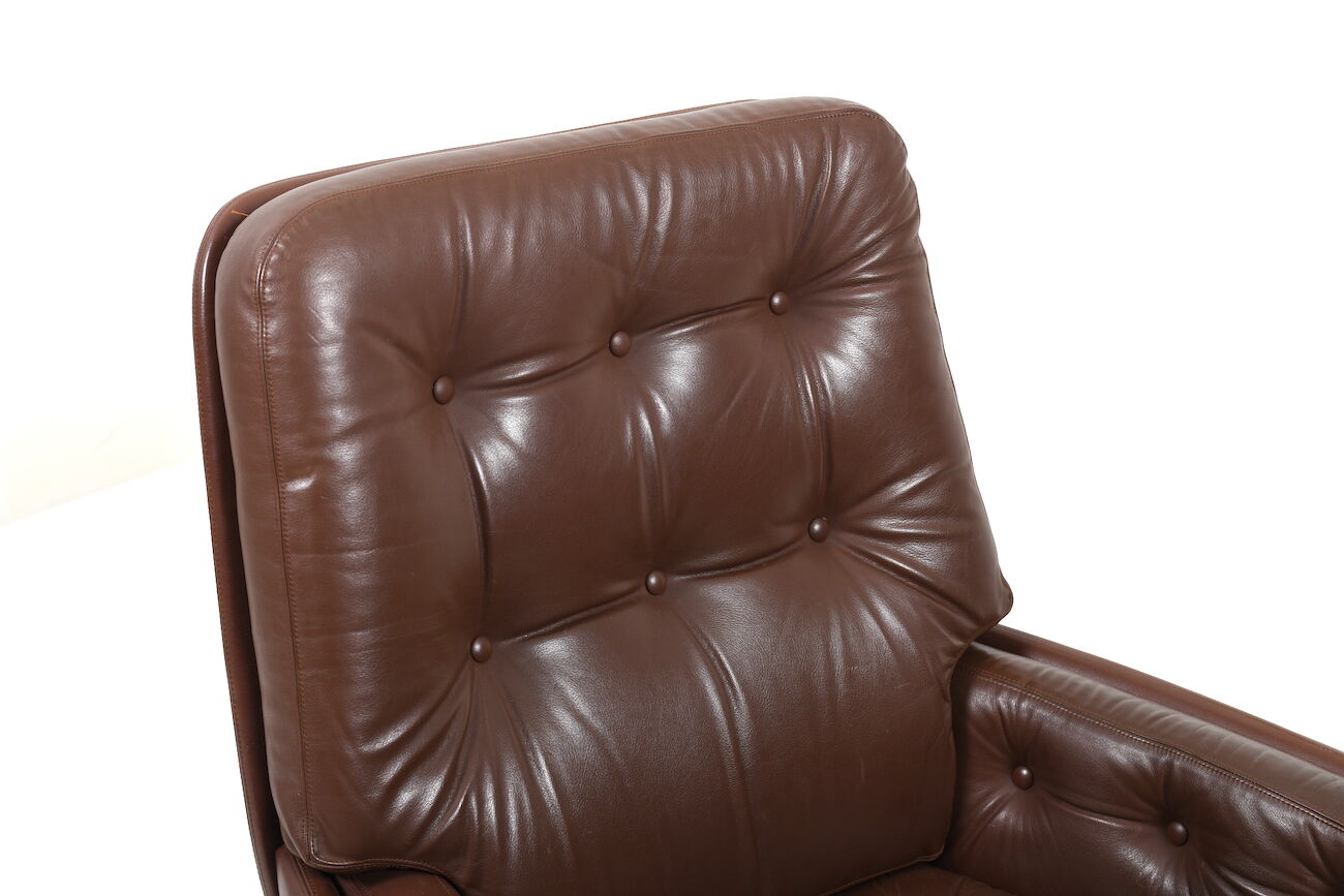 Danish swivel lounge chair in brown leather