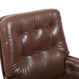 Danish swivel lounge chair in brown leather