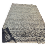 Rug in the style of a designer.