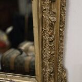 Large antique mirror from the Napoléon III era, finely carved and gilded with gold leaf.
