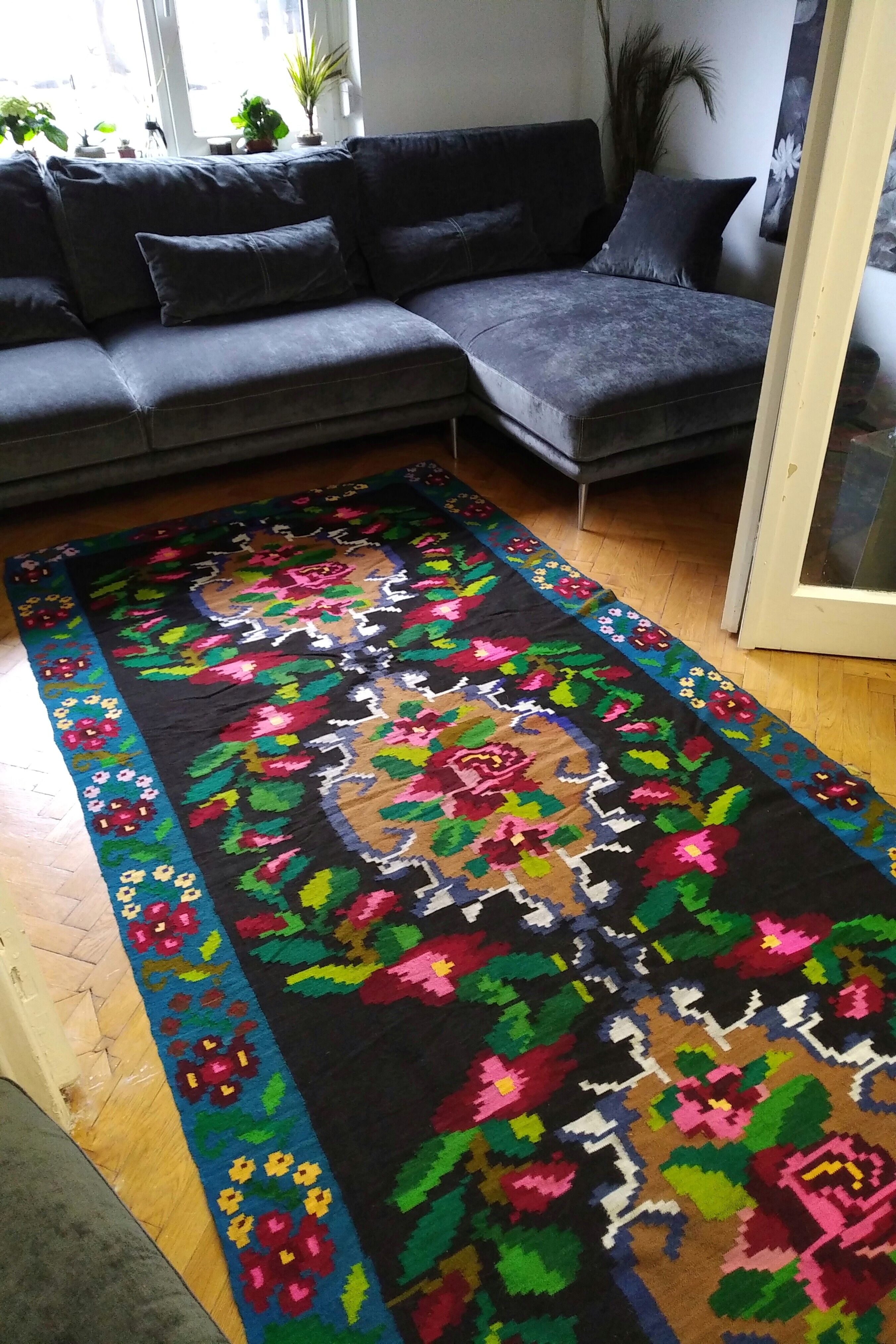 Romanian floral runner rug on blue background