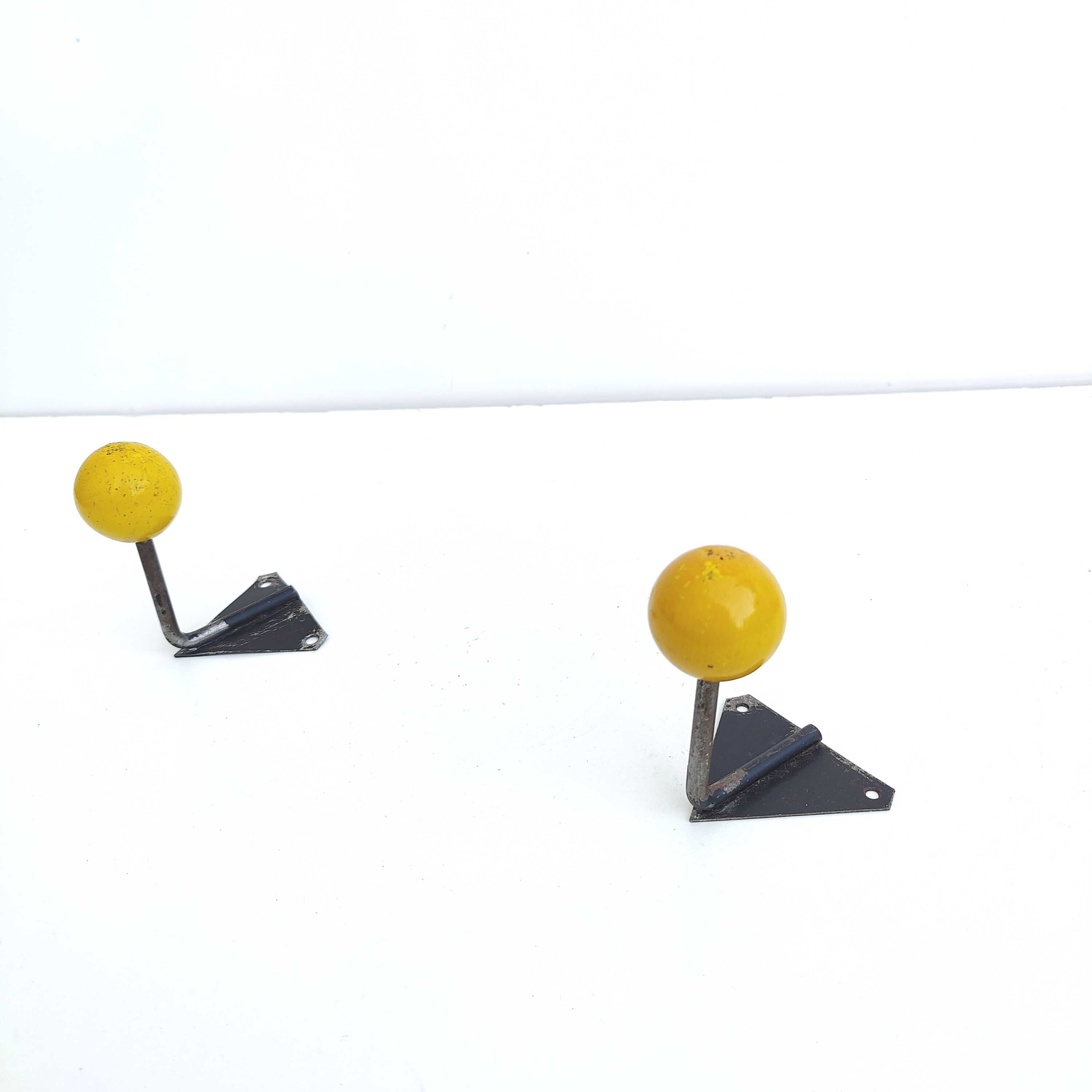 Two coat racks hooks balls yellow wood