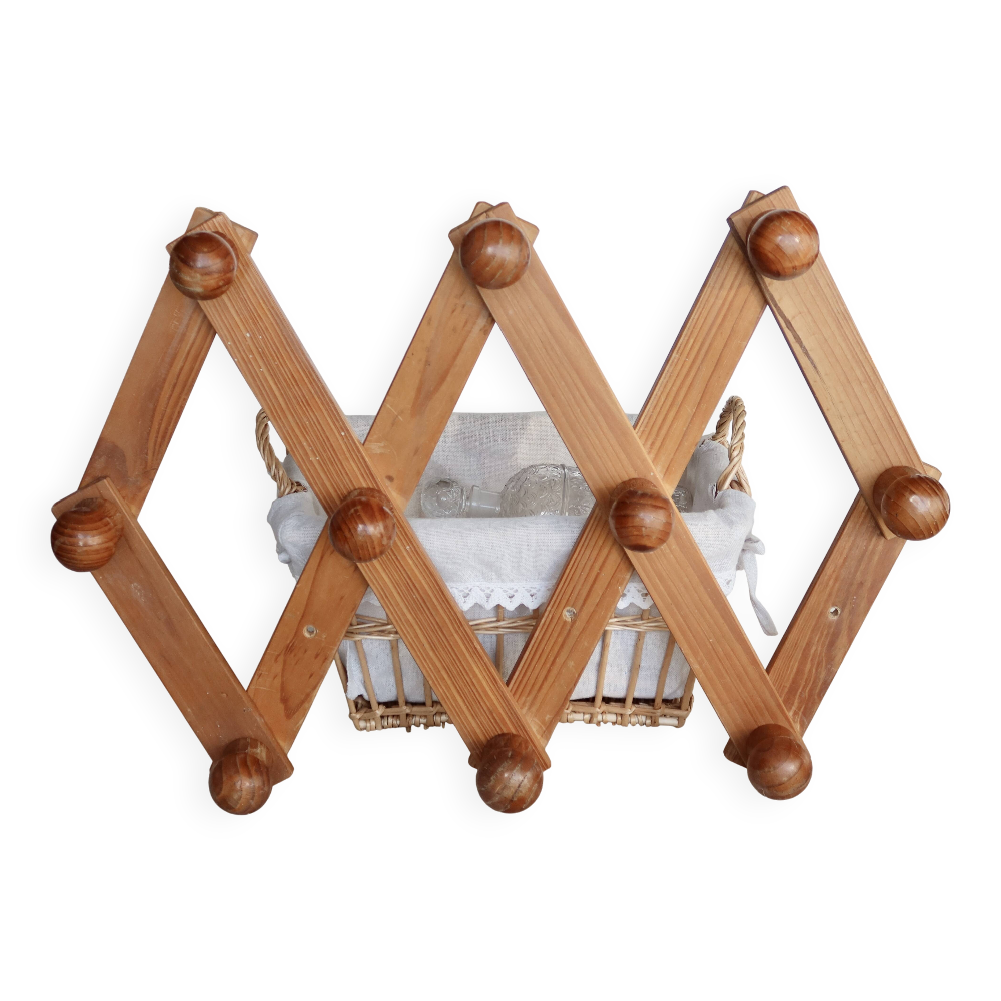 Antique wall-mounted coat rack accordion in dark pine, 10 wooden hooks.