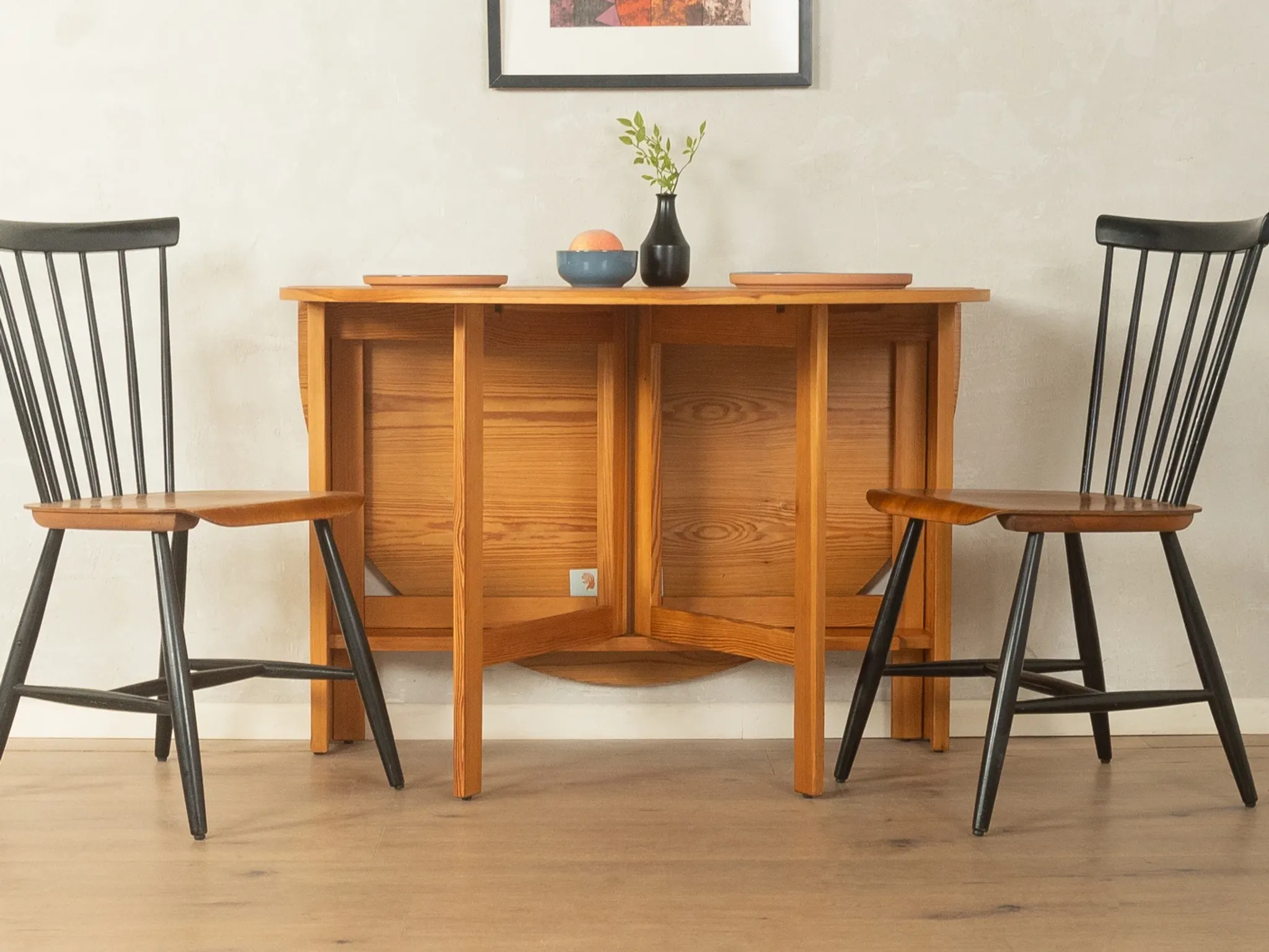 Practical folding table from the 1980s made of light brown pine wood