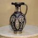 A jar of water pitcher made of tamgroute pottery handmade and adorned with bones.