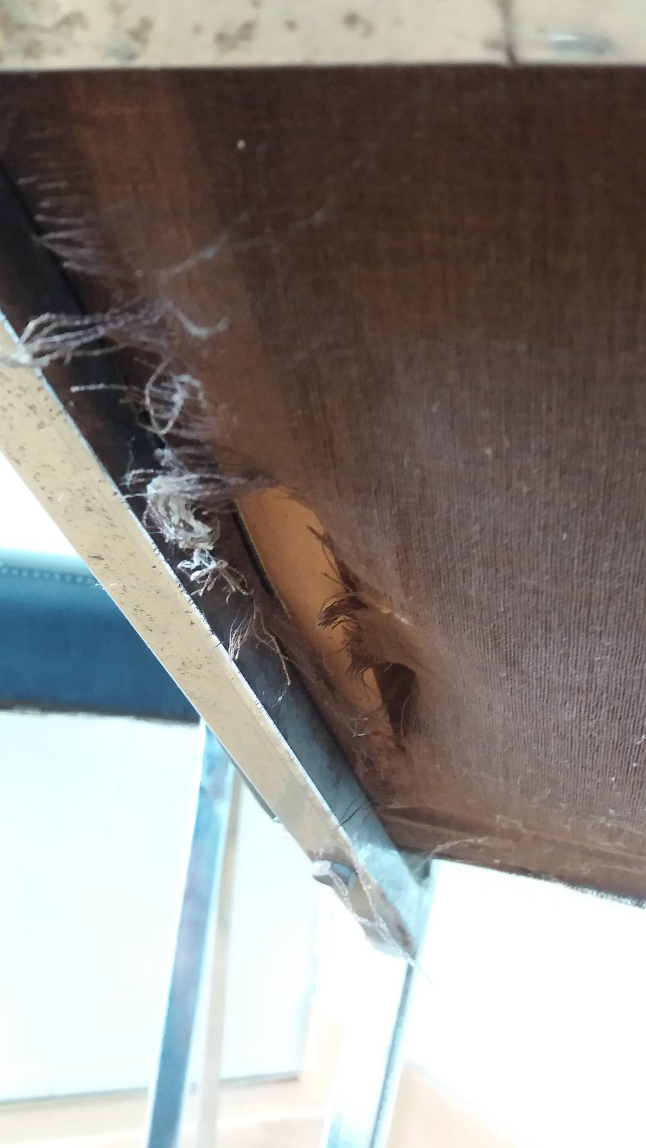 Chrome metal chairs and black faux leather upholstery in retro modernist style.