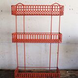 Vintage shelf in red openwork metal