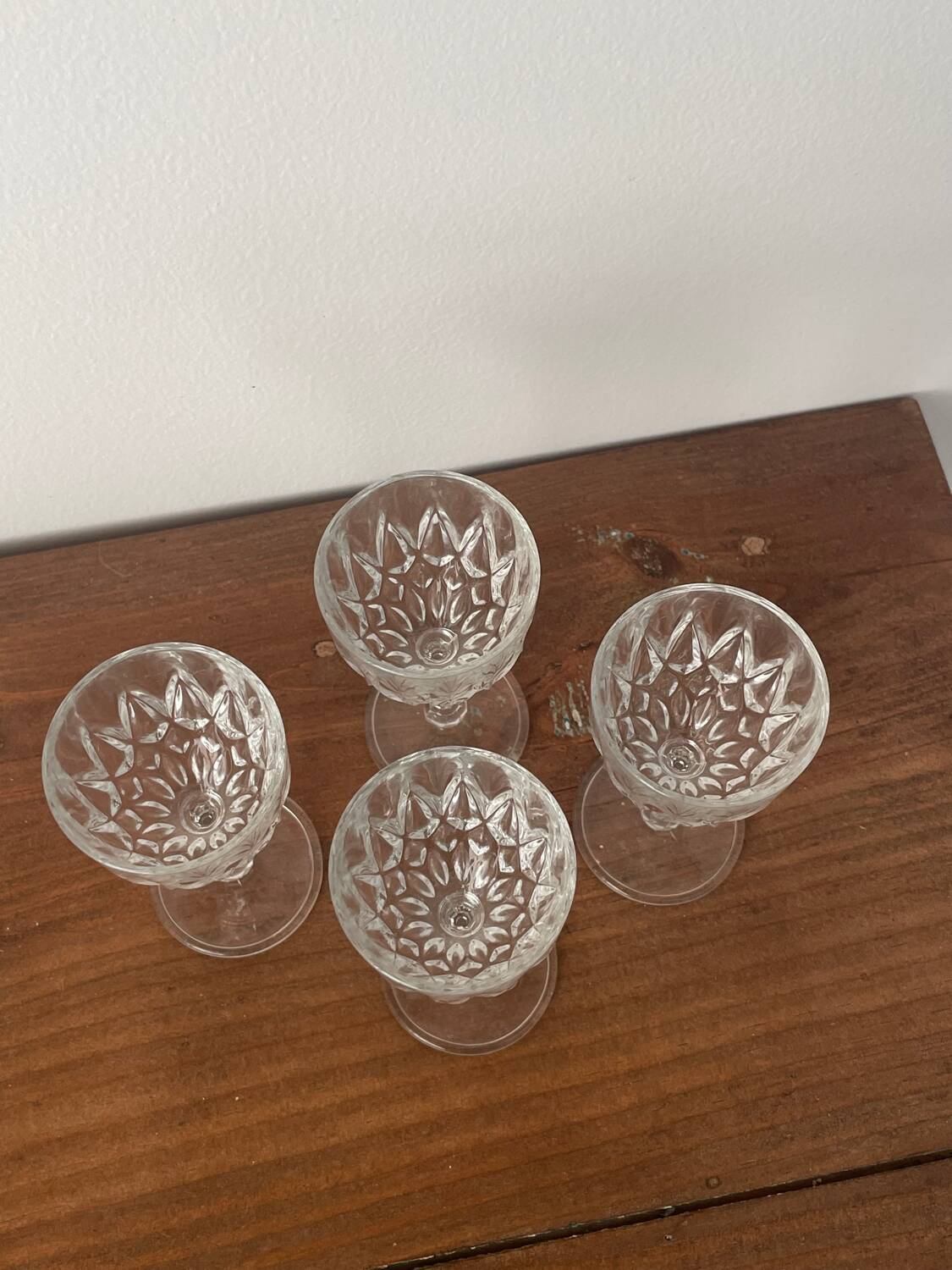 4 cut glass liqueur glasses on stems