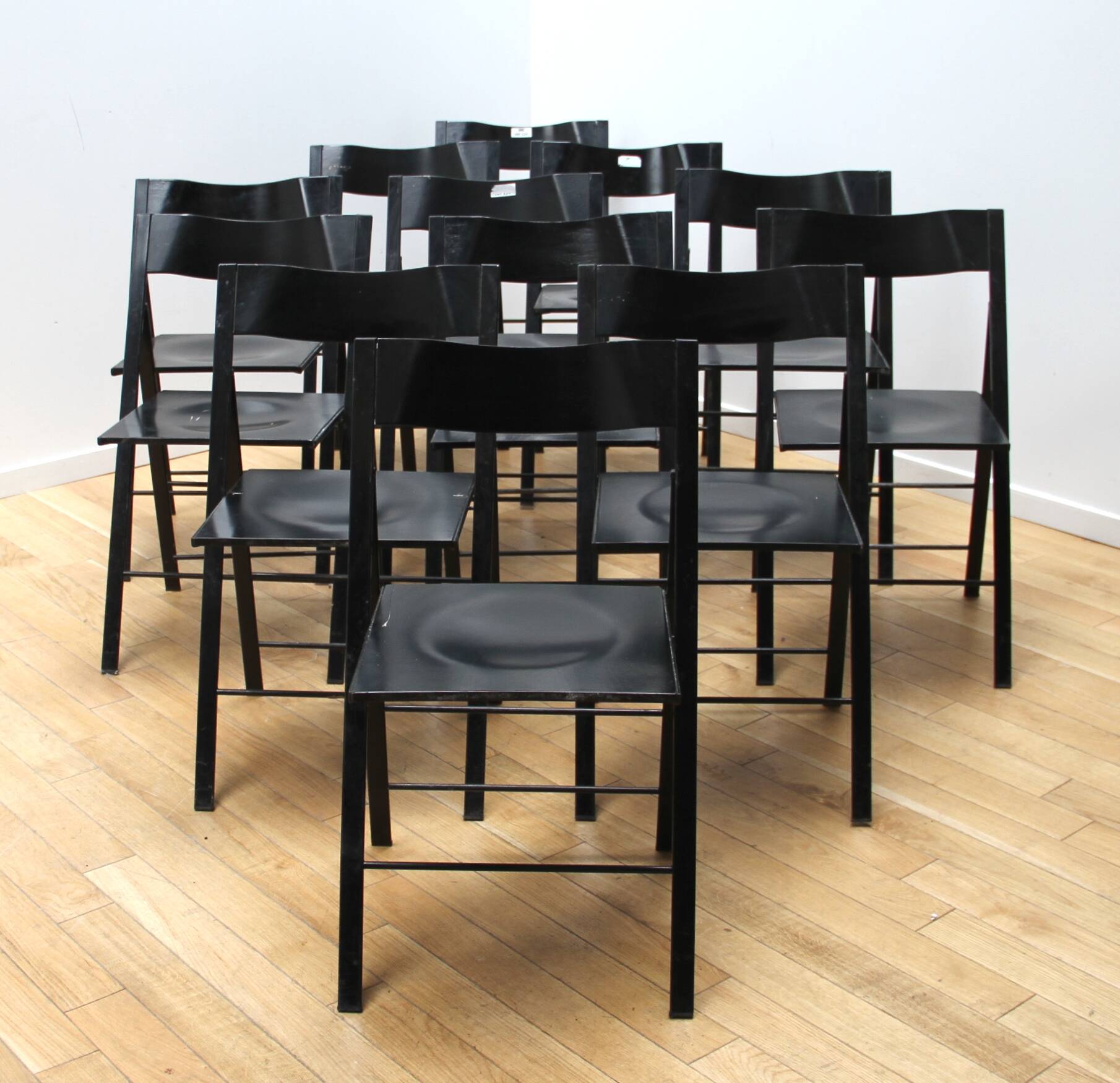 Suite of 12 folding designer chairs
