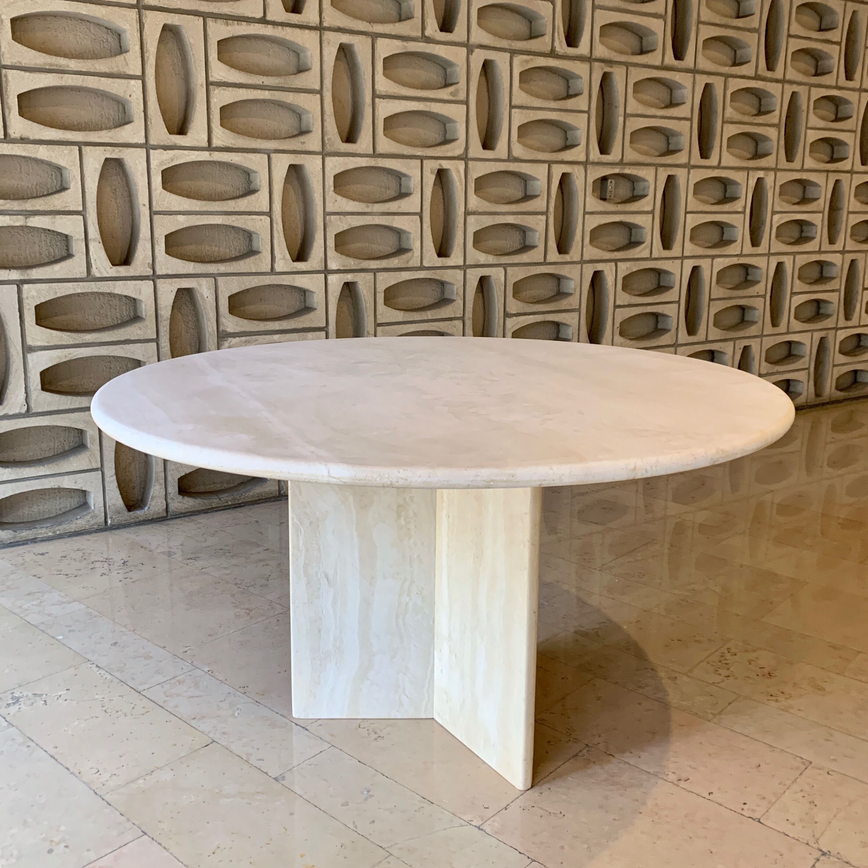 Round travertine dining table