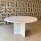 Round travertine dining table