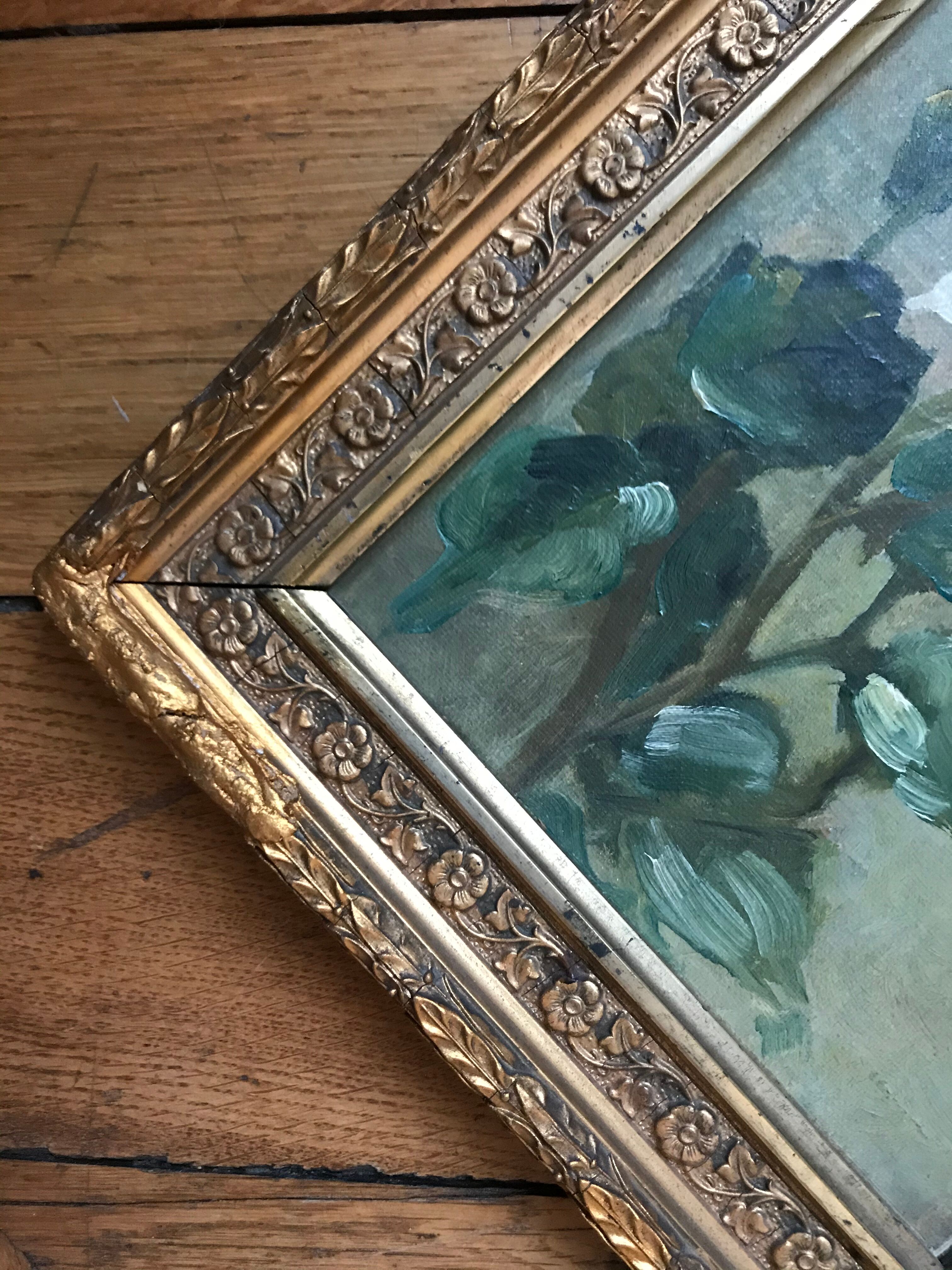 Two old paintings of flowers and gilded frames