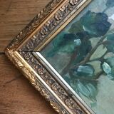 Two old paintings of flowers and gilded frames