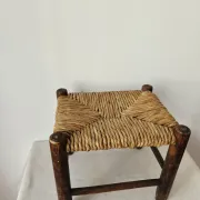 Small rustic vintage wooden and straw stool -