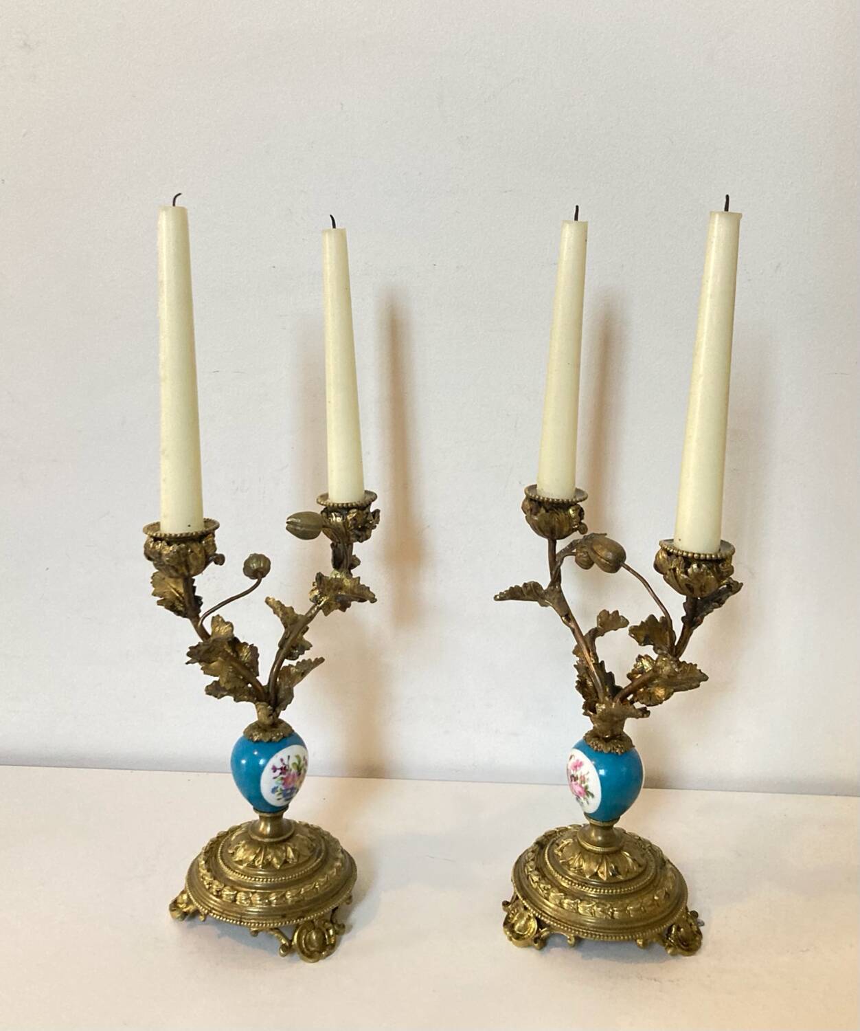 19th century candle holders in gilded bronze and porcelain