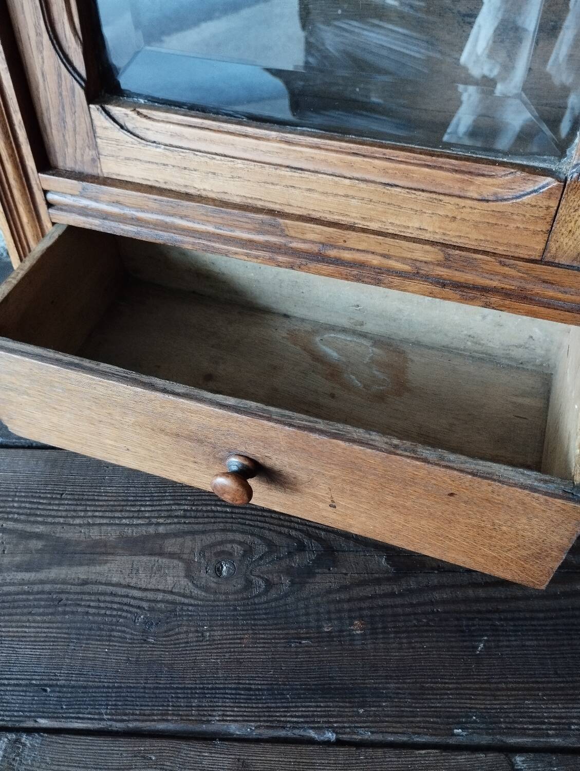 Old glass wall shelf with drawer door