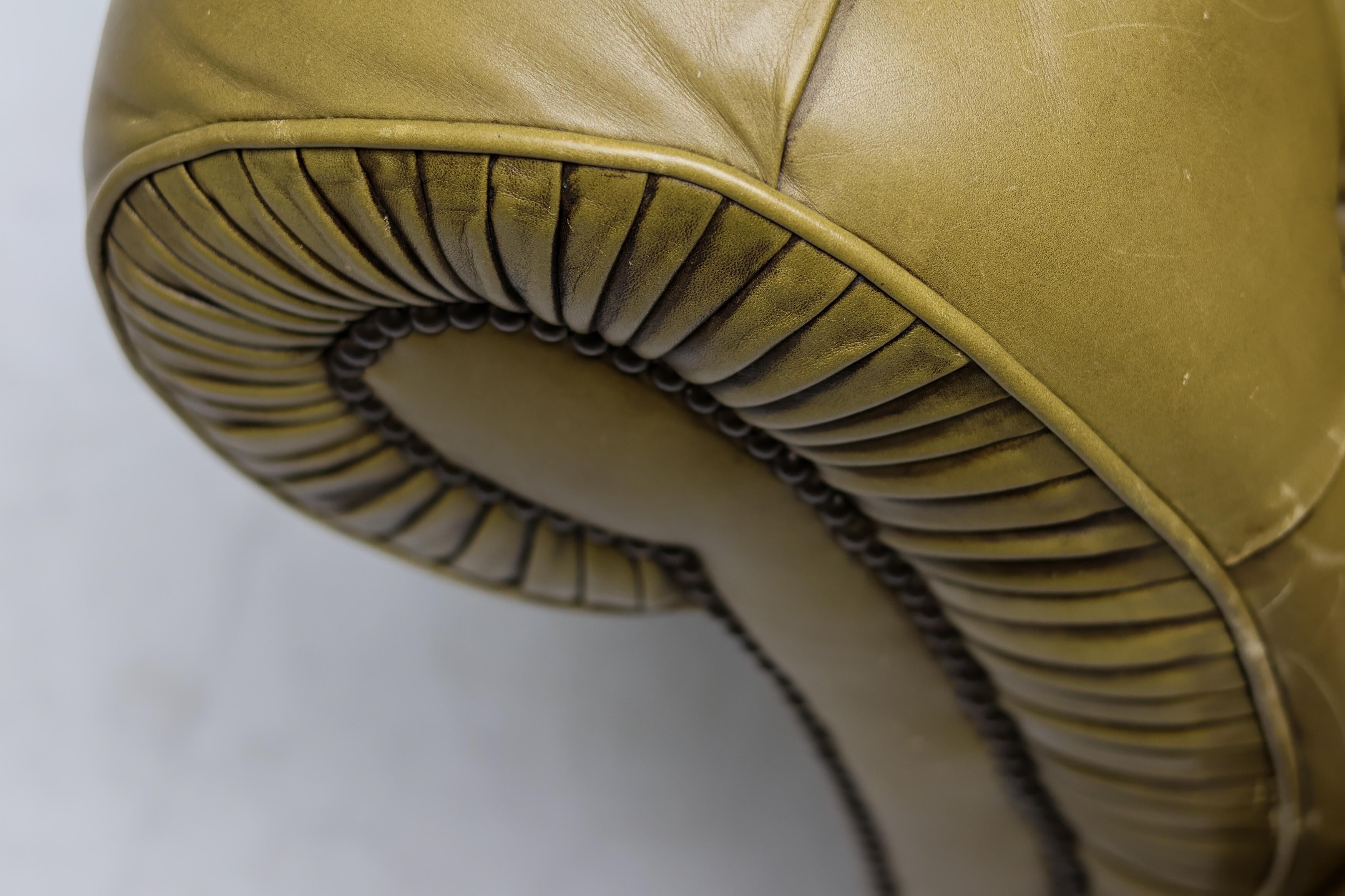 Vintage mid-century Chesterfield sofa in Greene & Greene leather.