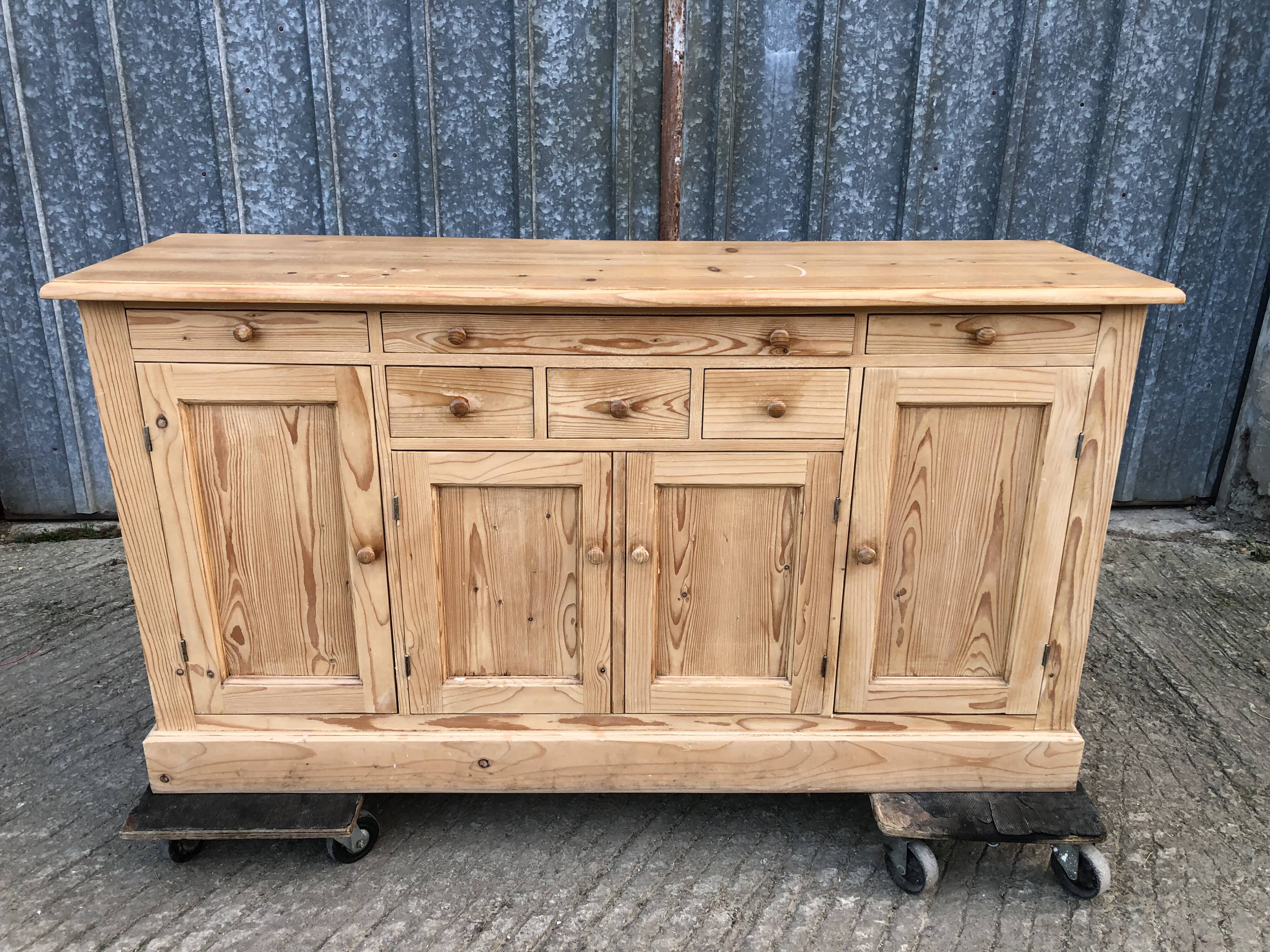 Scandinavian natural pine sideboard with 4 doors and 6 drawers.
