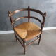Old straw corner armchair