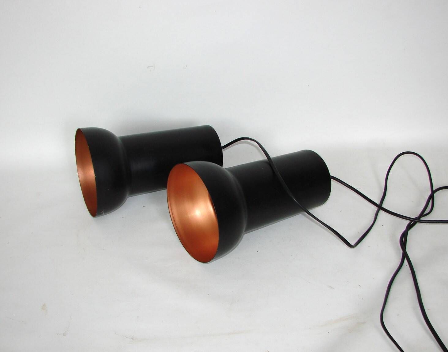 A pair of vintage pendant lights – black brass, modernist