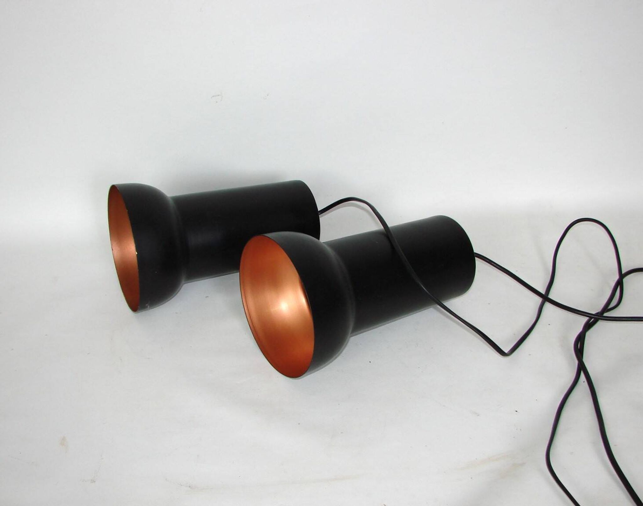 A pair of vintage pendant lights – black brass, modernist