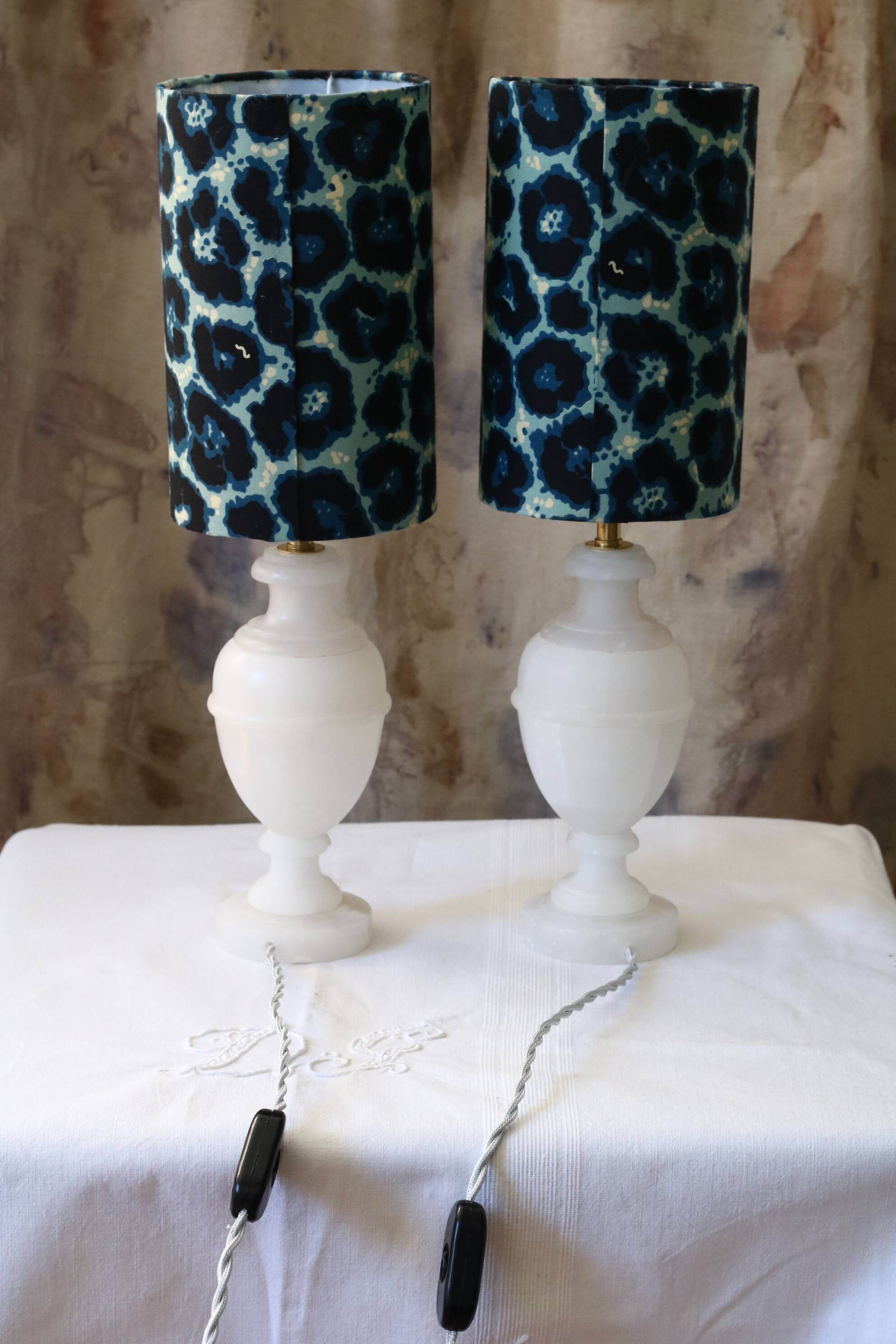 Pair of alabaster bedside lamps with blue leopard shades