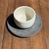 White Indonesian ceramic cup and gray saucer