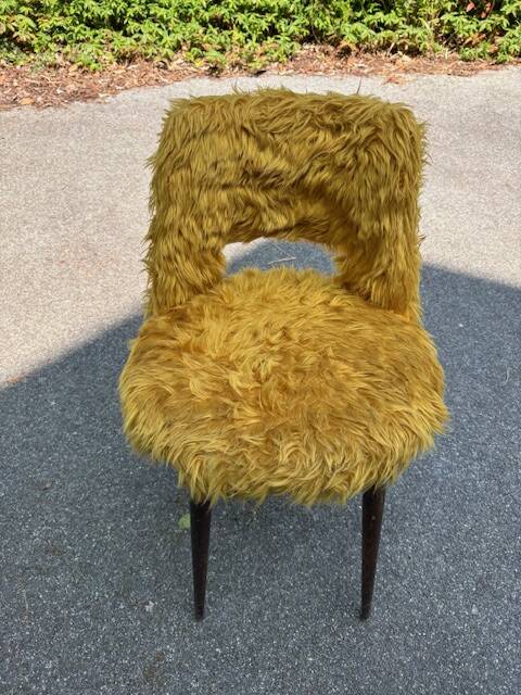 Old mustard furry armchair