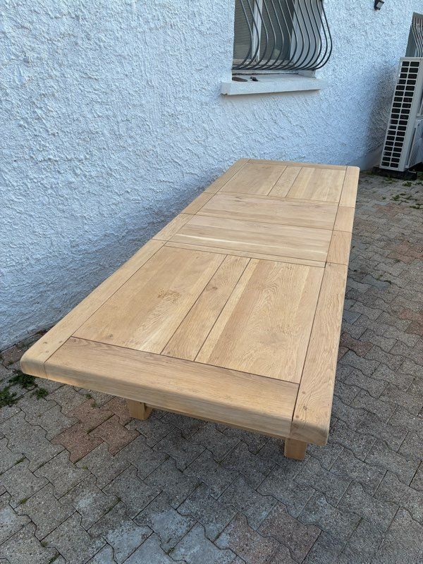 Solid oak farmhouse table with extensions.