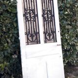 Porte d’entrée ancienne en chêne vitrée grilles en fonte 1925