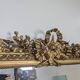 Golden Louis XVI style mirror with bouquet and shells.