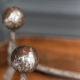 Pair of 1930 modernist chenets decorated with a ball