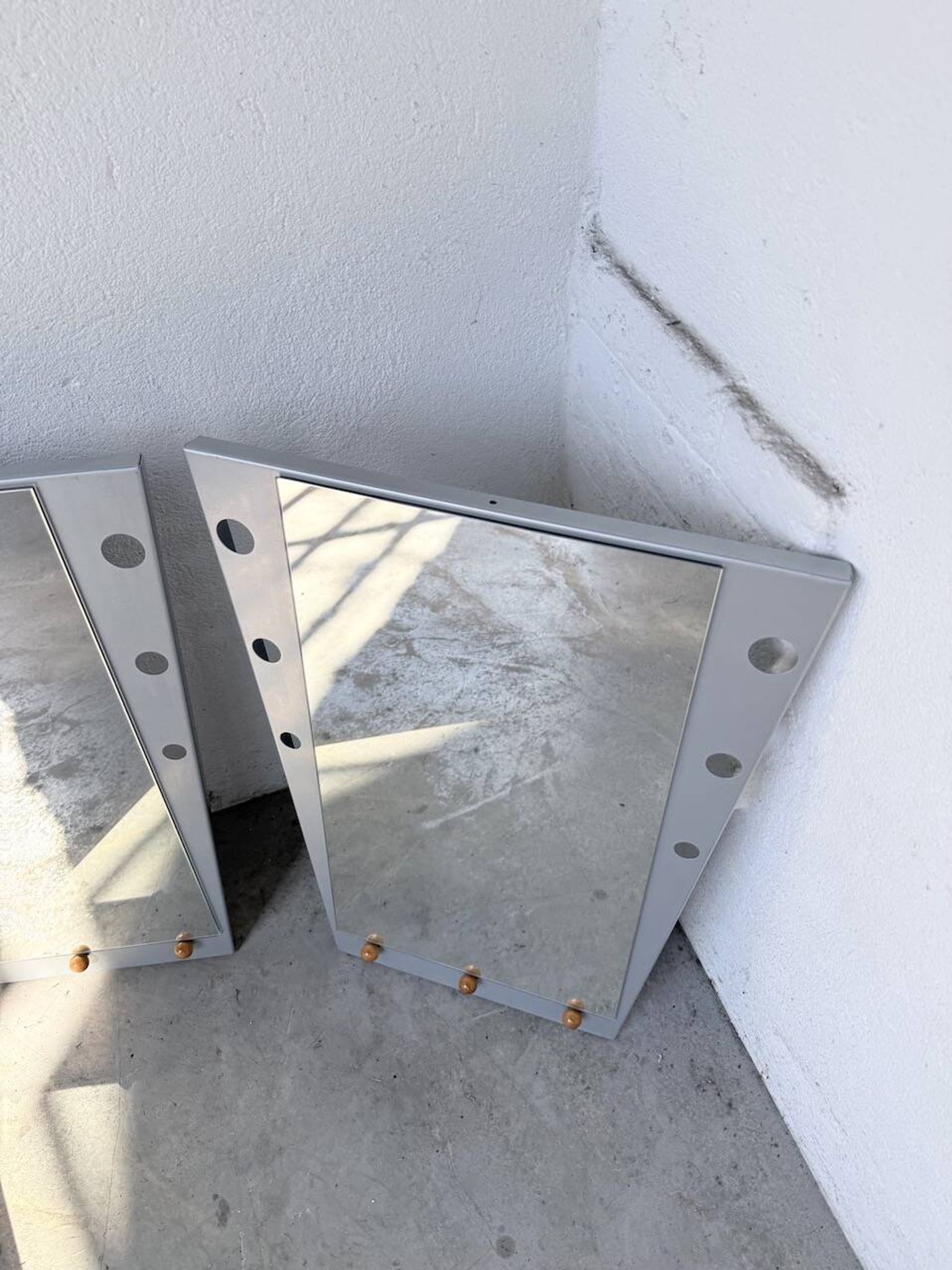 Pair of "Memphis" mirrors from the 80s in chrome and wood.