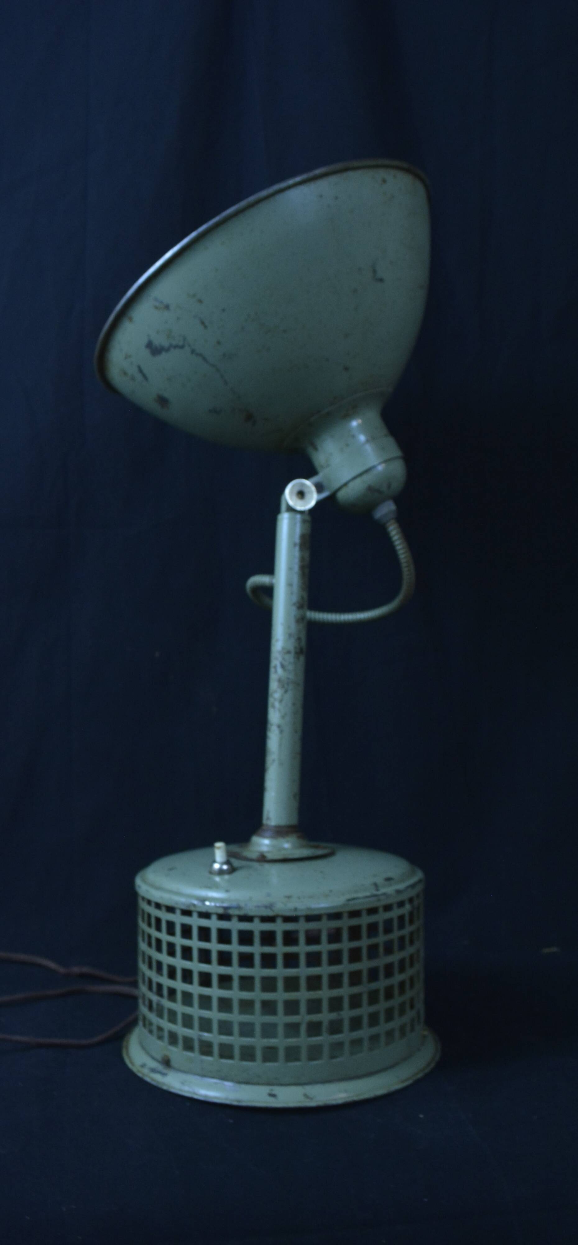 Industrial metal parabola lamp.