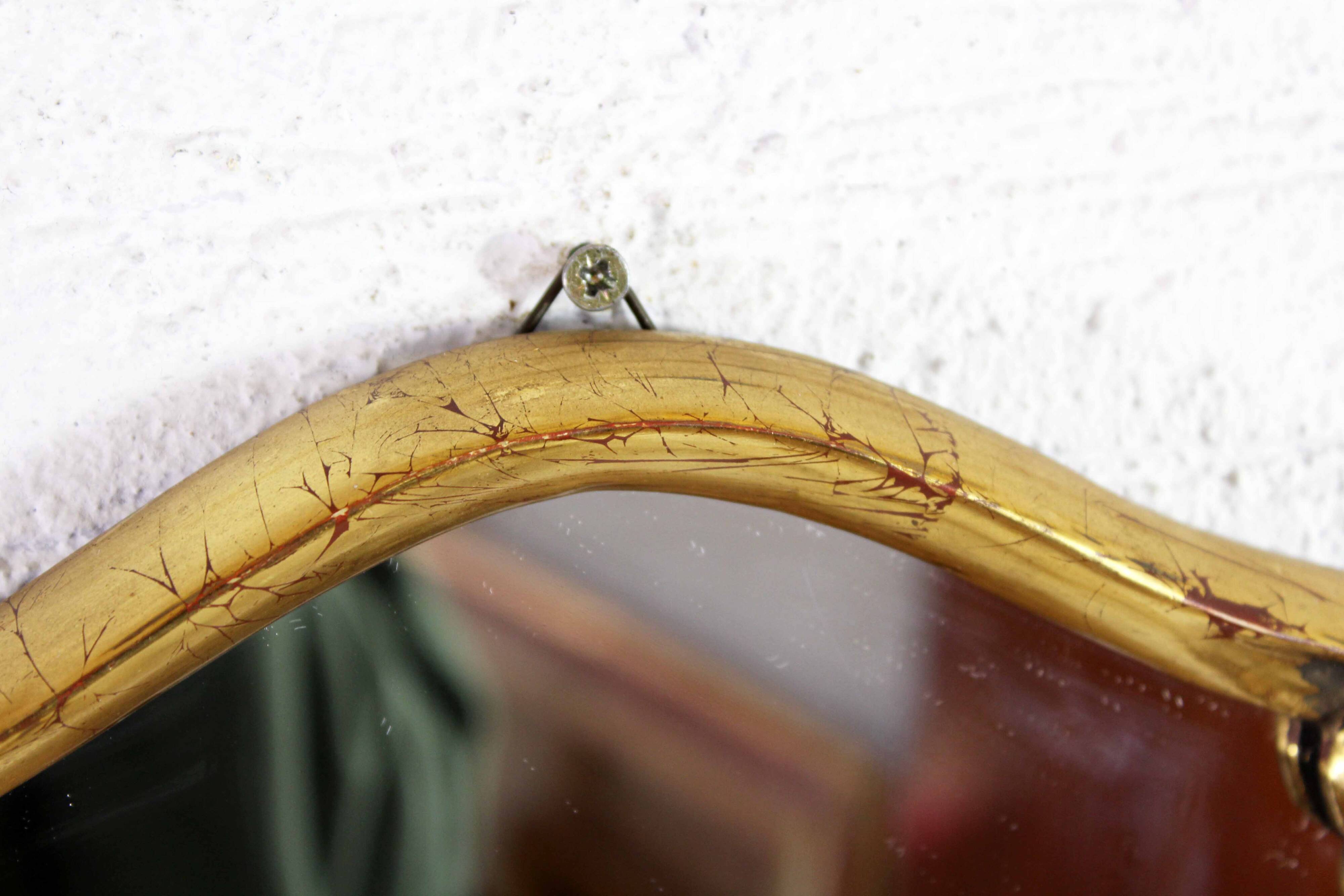 Mirror in gilded wood with leaf