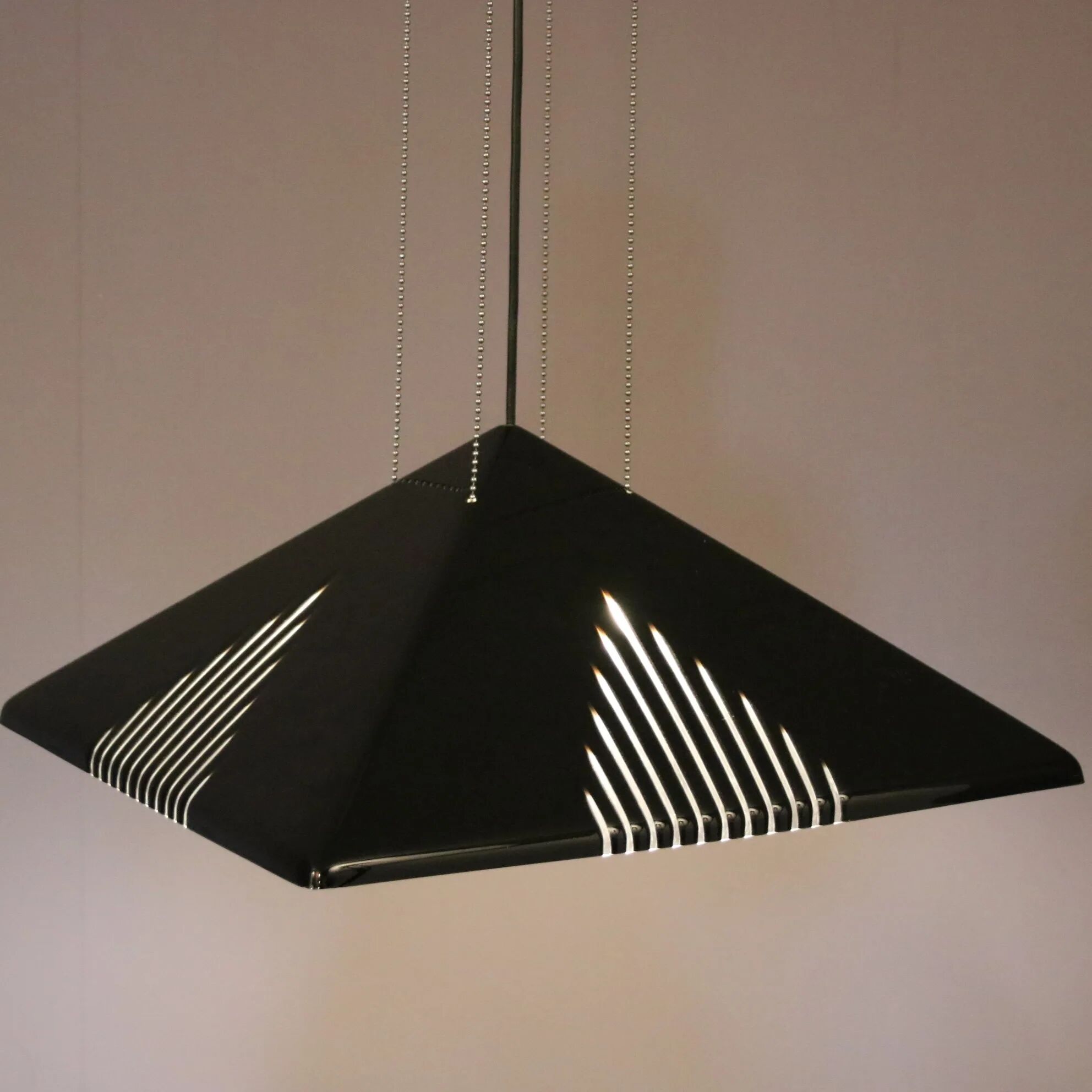 Black plexiglass pendant lamp from the 1980s, mounted on chains, originating from Italy.