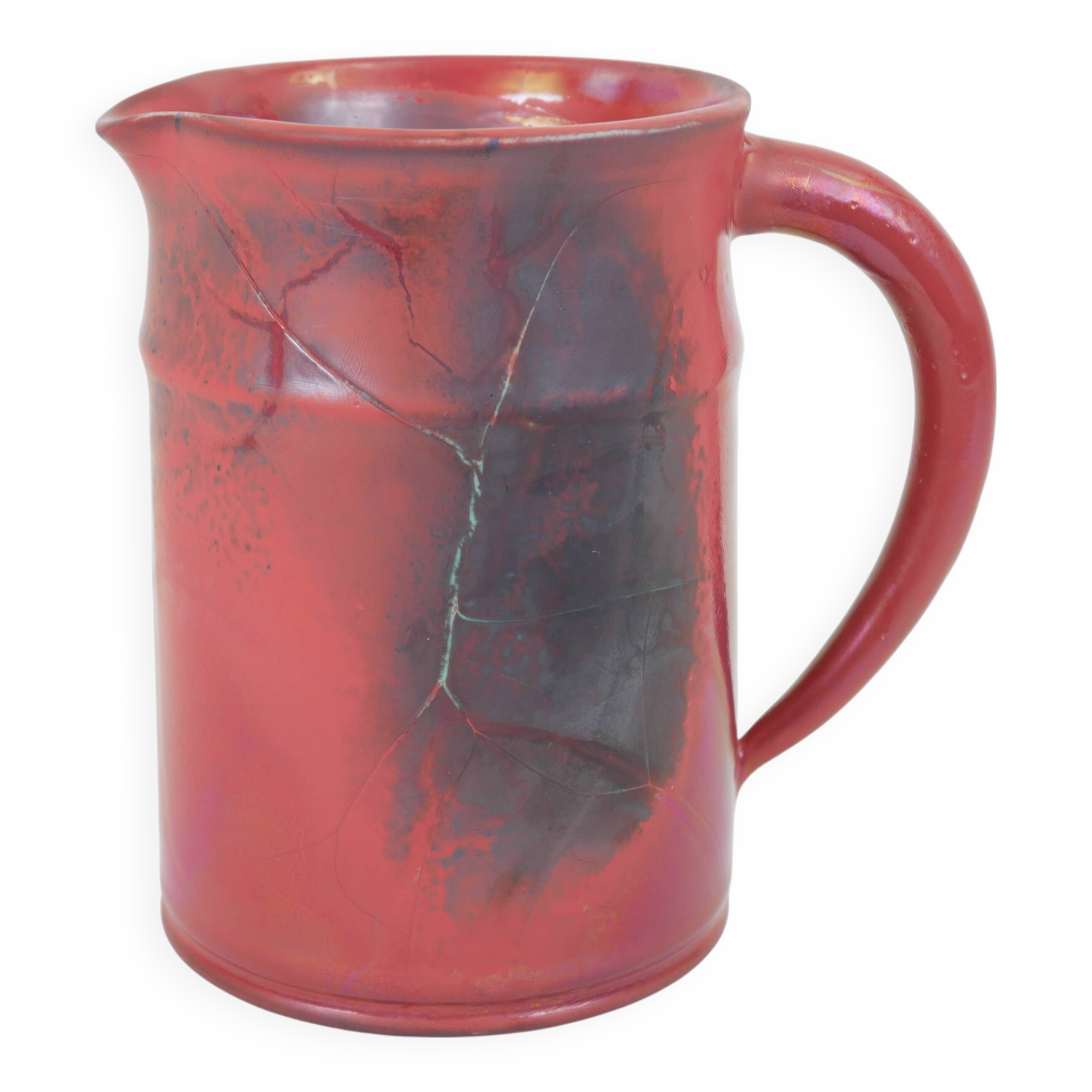Red glazed ceramic jug with relief
