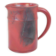 Red glazed ceramic jug with relief