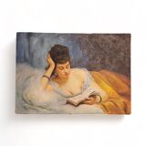 Young woman lying reading oil on panel