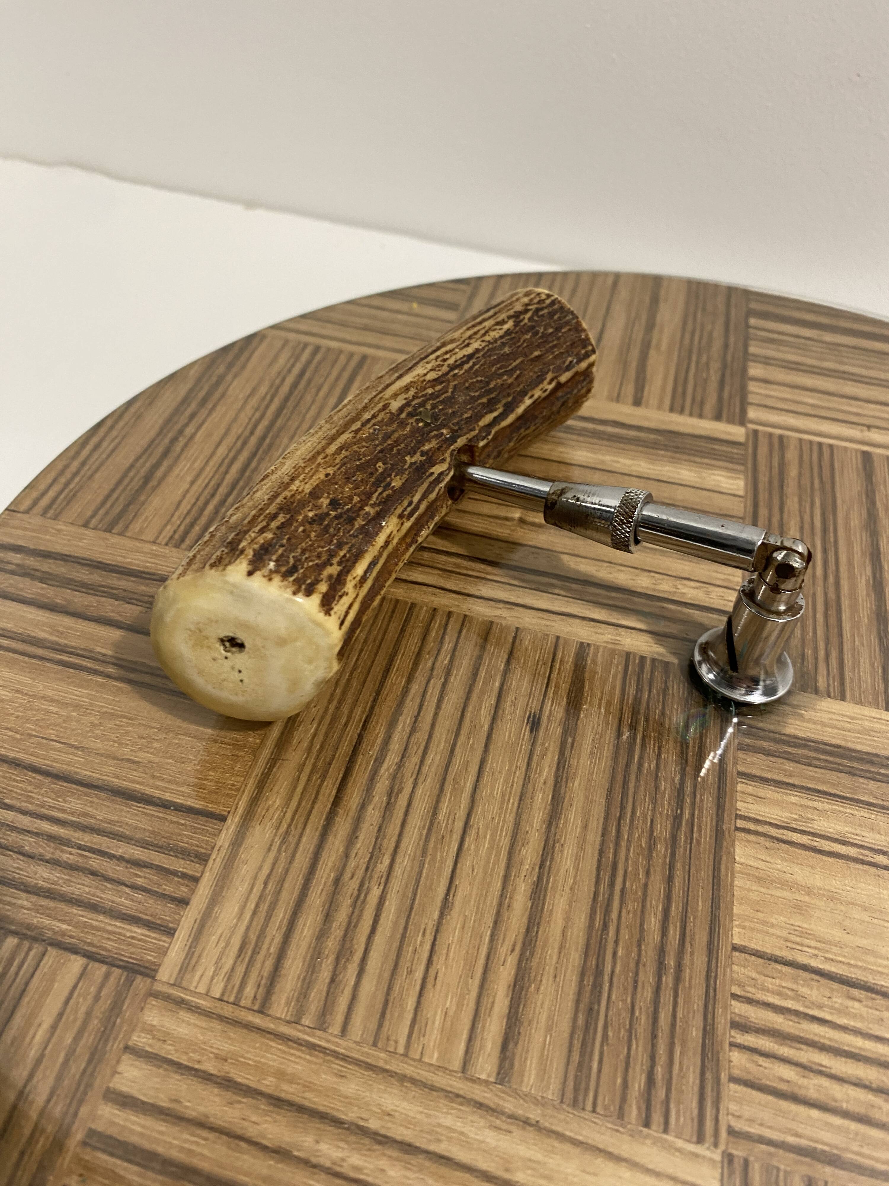 Vintage round wooden cheese board covered with glass plate with foldable handle